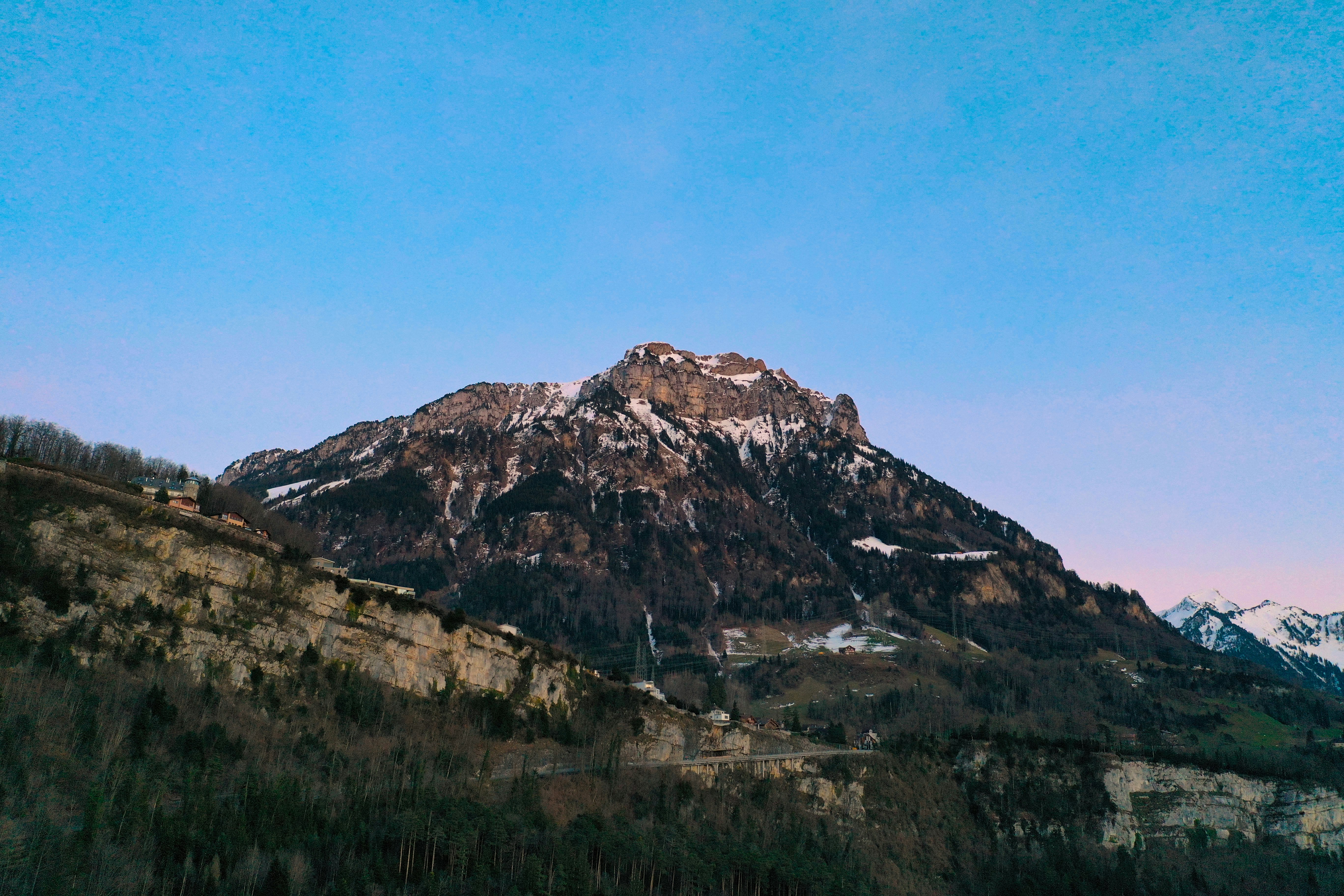 brown and white mountain under blue sky during daytime